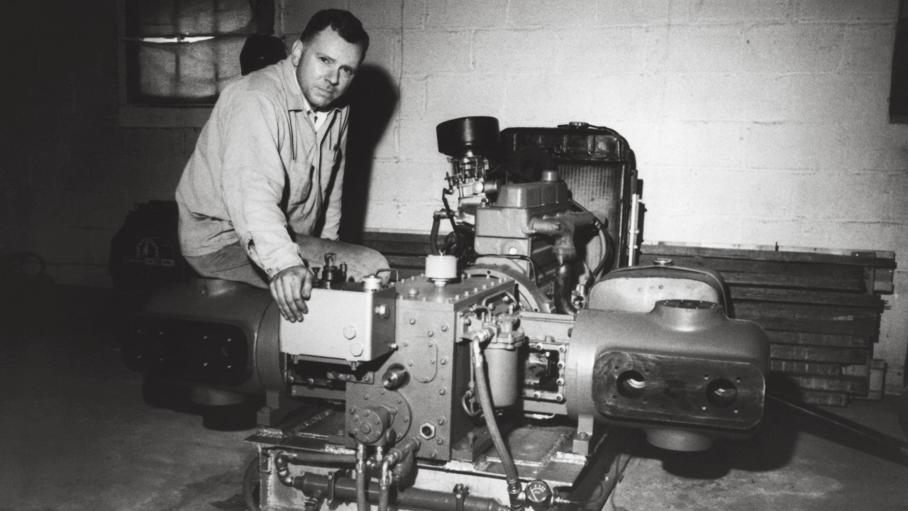 Jim Buchwald sits with his Ariel prototype, serial number one, the first in the JG line of compressors, after it has completed a 10 hour run test.