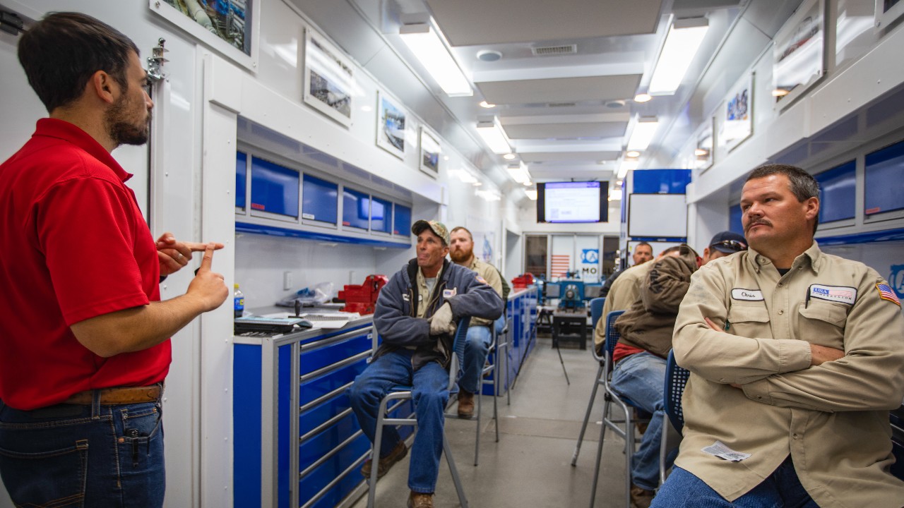 Trainer teaching a group of students in Ariel's mobile training lab